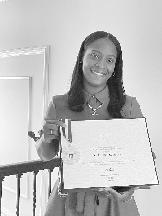 Rachel Sherman holds her Presidential Lifetime Achievement Award she received June 19 at Black Excellence Networking and Awards Event in Bowie, Maryland.