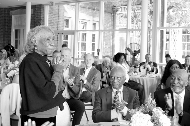 Photo credit Elyzabeth Marcussen Cherrie Britton stands to be recognized after Joyce Phillip shared how Hospice of the Chesapeake cared for her husband. “Hospice was the best thing that I did for John over his eight years of my caring for him,” she told Joyce.